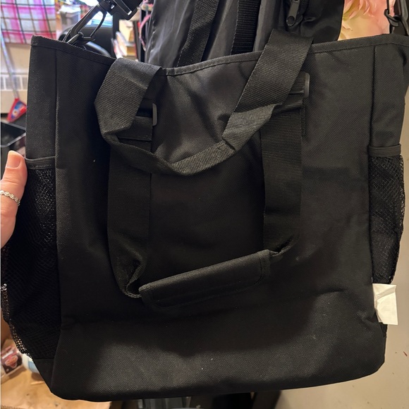 An Ed Hardy messenger bag. - Picture 2 of 6